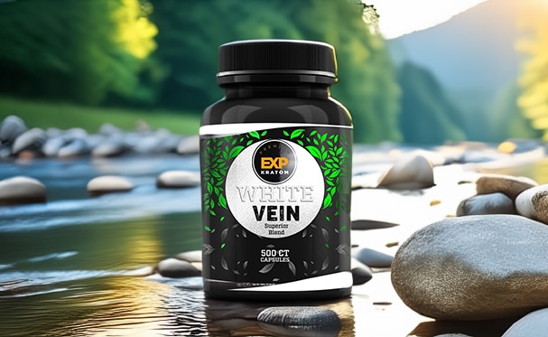 A bottle labeled "EXP Premium 500ct Capsule Bundle (choose 4)" placed on rocks by a river, with a forested area in the background.