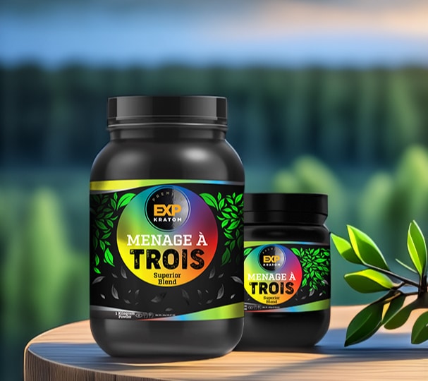 Two black containers of the New EXP Premium Menage A Trois Powder Jar are placed on an outdoor surface with a blurred forest background, showcasing their premium quality.